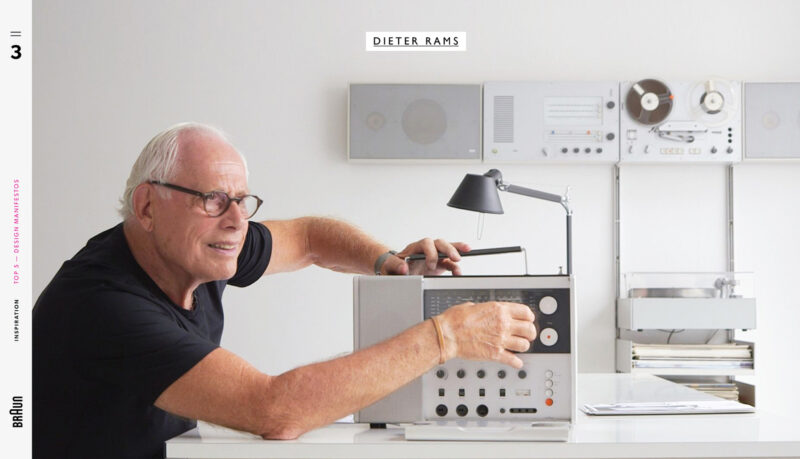 Dieter Rams, wearing glasses, adjusting the controls on a Braun audio unit on a white shelf.