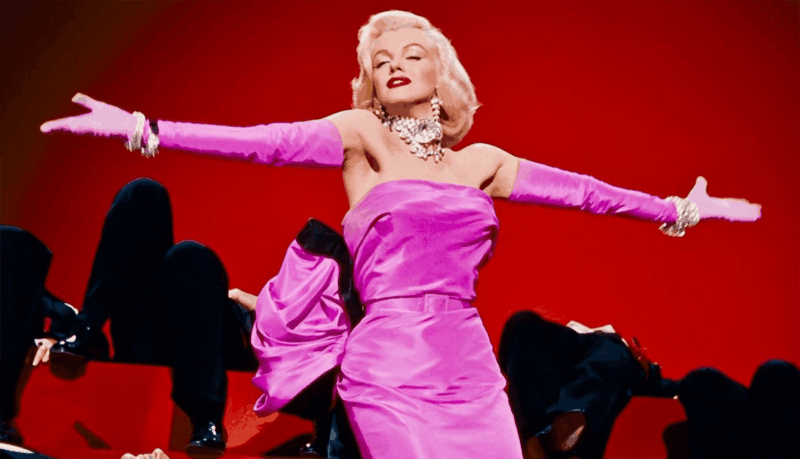 Marilyn Monroe wearing a pink dress in "Gentleman Prefer Blondes"