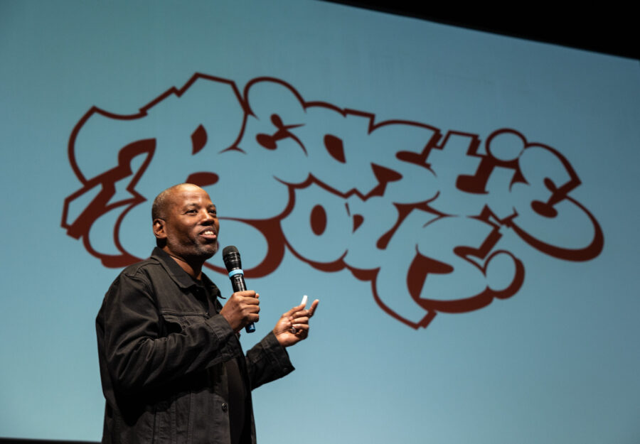 Cey Adams on stage presenting