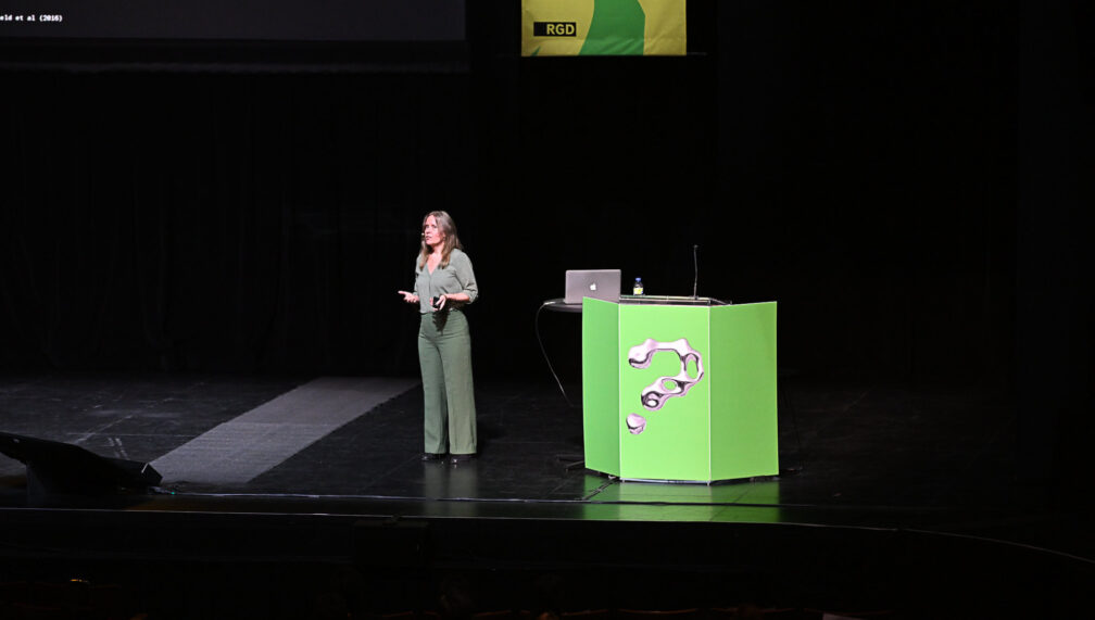 Emmi Salonen on stage presenting